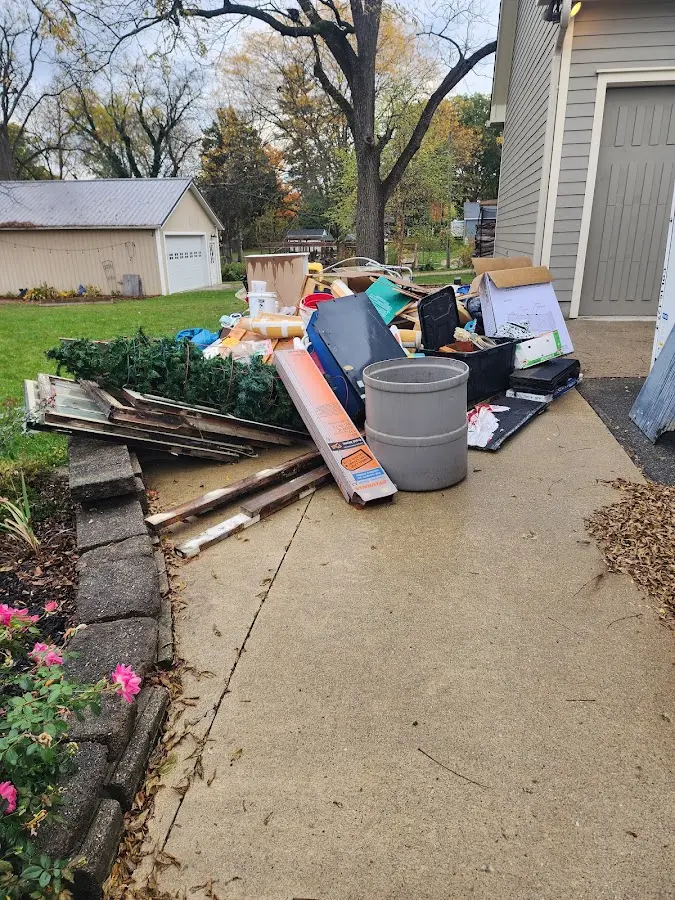 Dumpster being loaded with debris for Commercial Dumpster Rental in Los Chaves